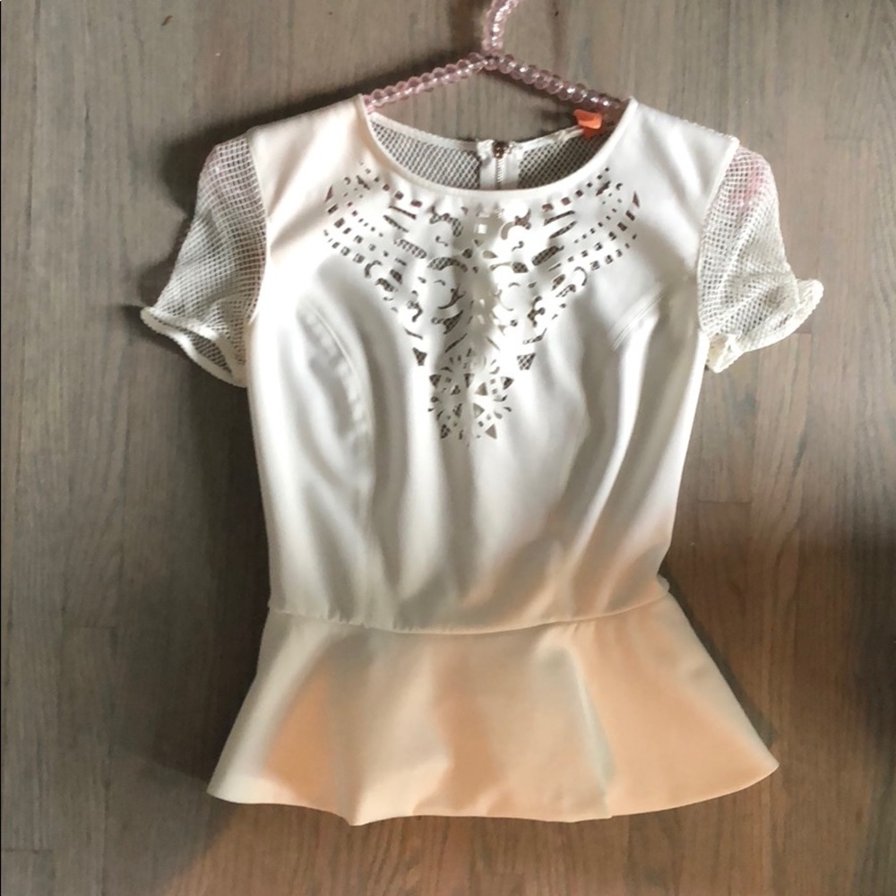 White, peplum top with cutouts